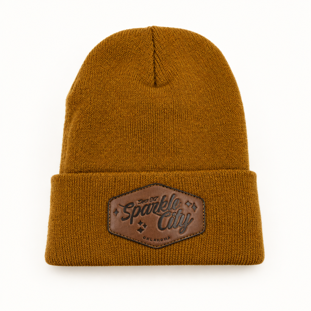 Sparkle City cuffed beanie with leatherette patch on a studio background