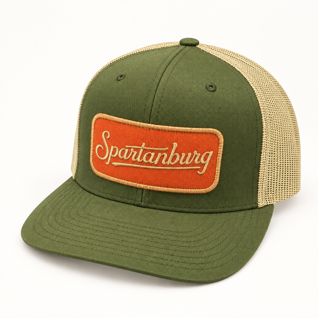 Spartanburg Yupoong trucker snapback hat shown in a clean studio product shot